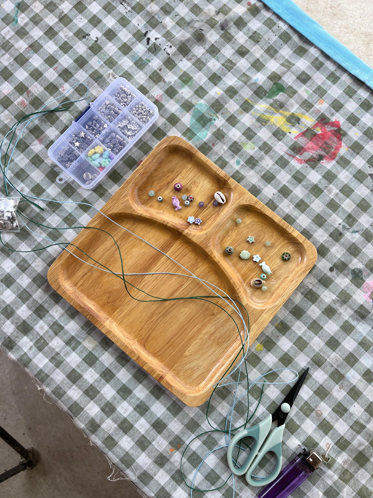 Colorful beads and tools on a workshop table